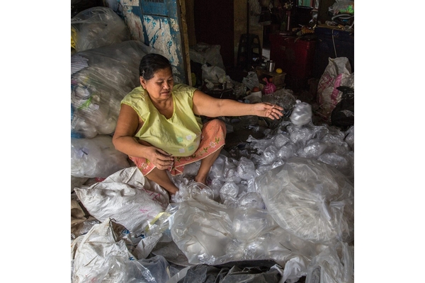 Image An Asian woman sitting in plastic.